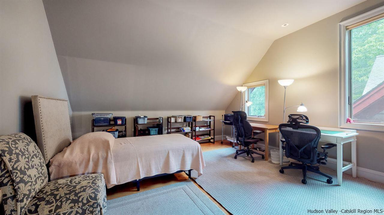 9 Torrens Hook Road, Unit DANCING ROCK Shokan, NY 12481 - Photo 17 of 23 a bedroom with furniture and a large window