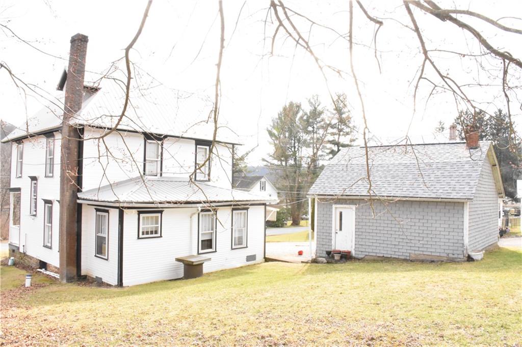 747 Stifflertown Road Cherry Tree, PA 15724 - Photo 3 of 24 a view of a white house with a yard and sitting area