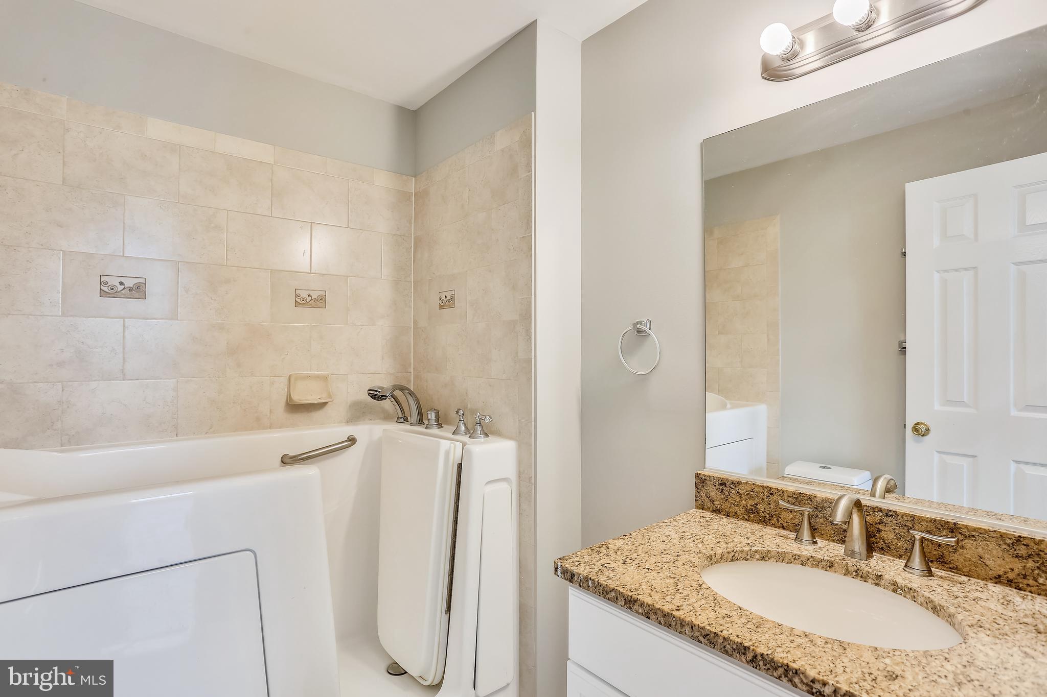 13929 Falconcrest Road Germantown, MD 20874 - Photo 24 of 76 Walk-in tub full bath #3 ensuite main level BR