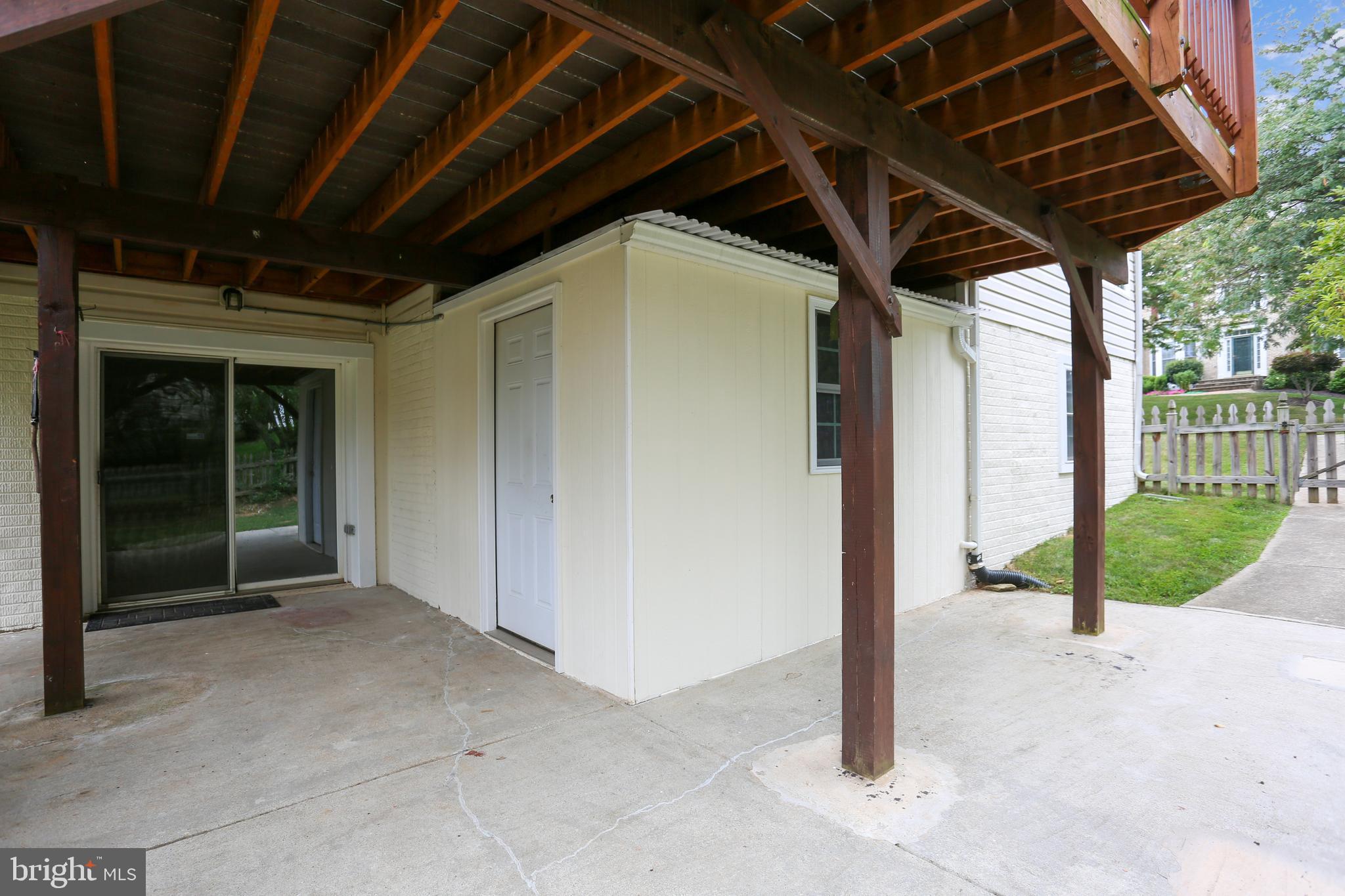 13929 Falconcrest Road Germantown, MD 20874 - Photo 52 of 76 Patio with built-in storage shed