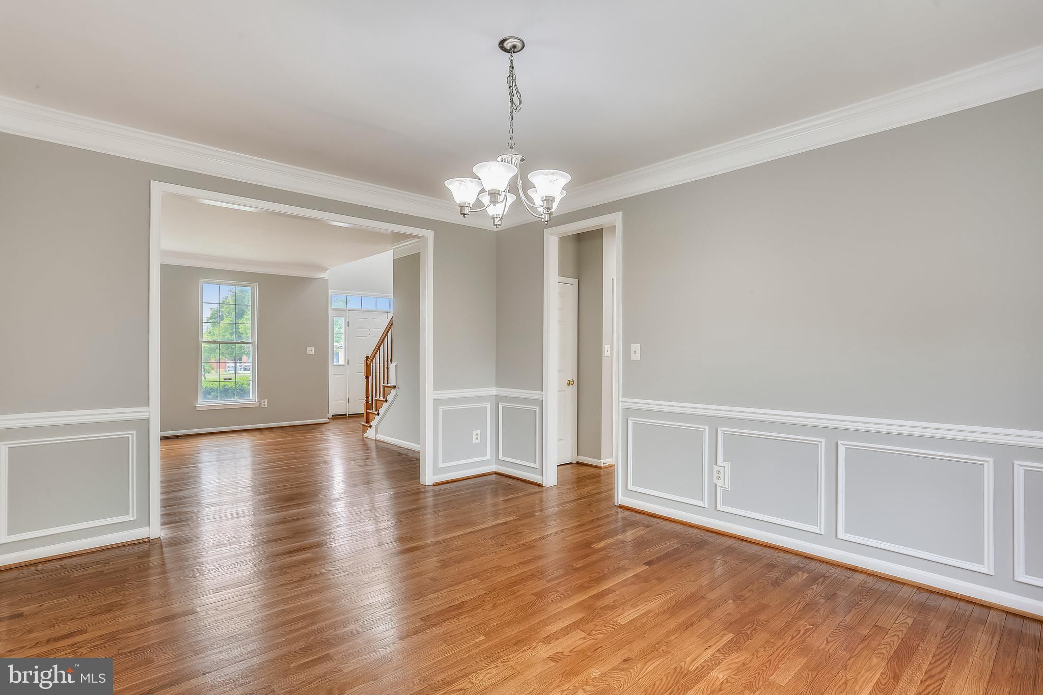 13929 Falconcrest Road Germantown, MD 20874 - Photo 9 of 76 Dining room with wainscoting and crown molding