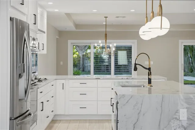 a bathroom with a sink a mirror and a shower
