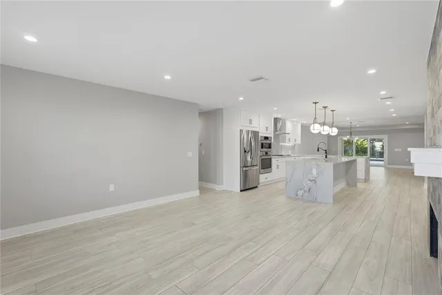 a view of kitchen and kitchen with a sink