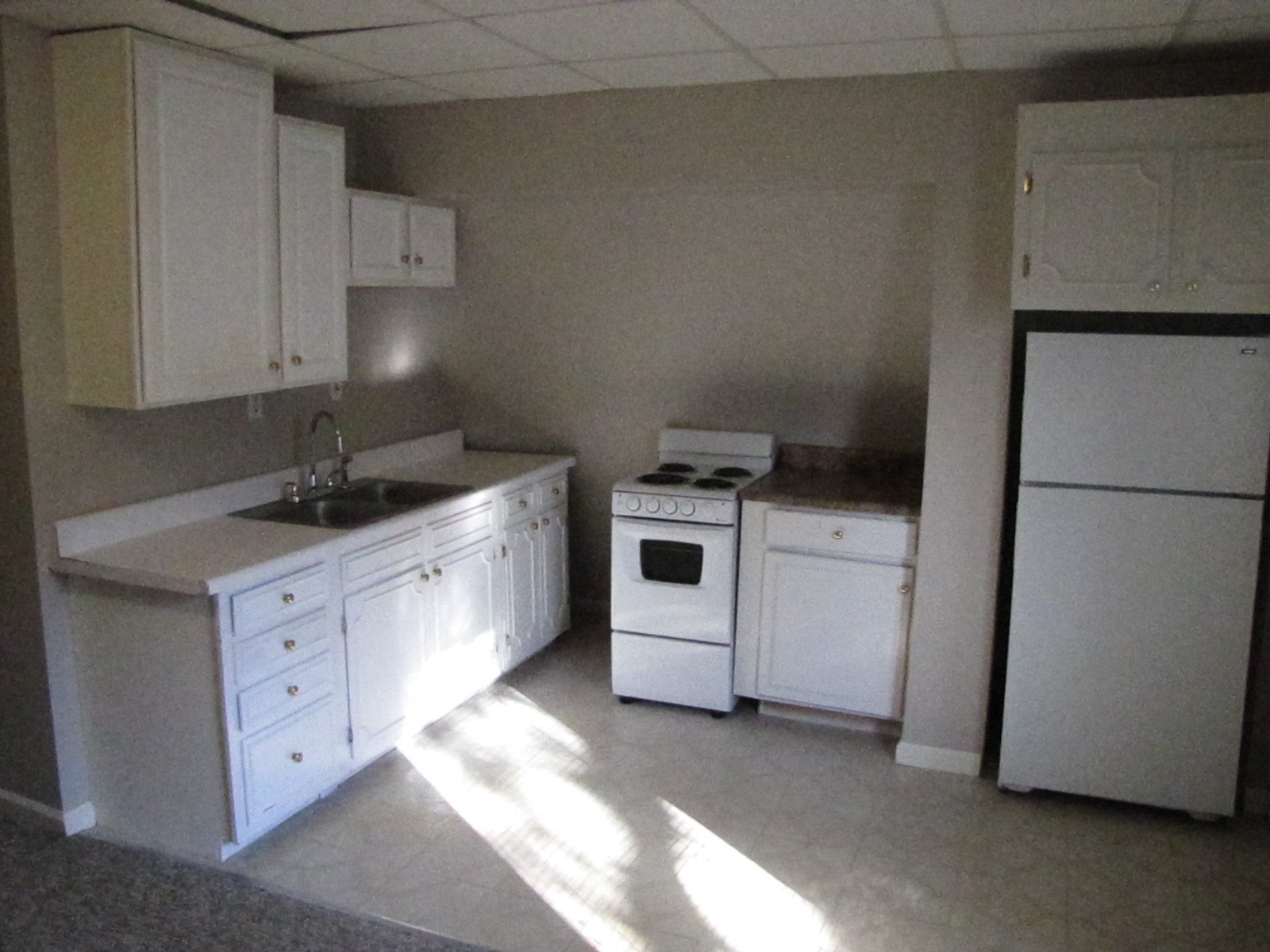 105 Diddle Drive Hendersonville, TN 37075 - Photo 3 of 7 a kitchen with white cabinets and white appliances