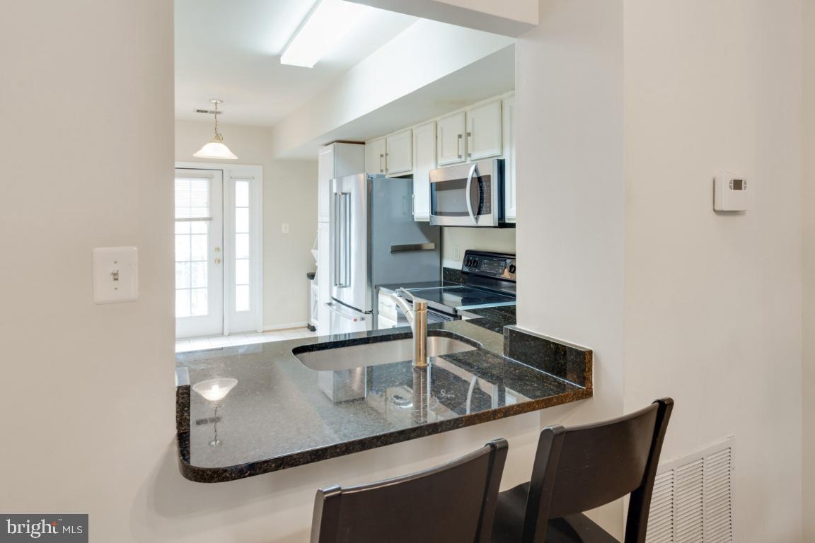 11326 King George Drive, Unit 7 Silver Spring, MD 20902 - Photo 8 of 34 New Granite counters and breakfast bar!