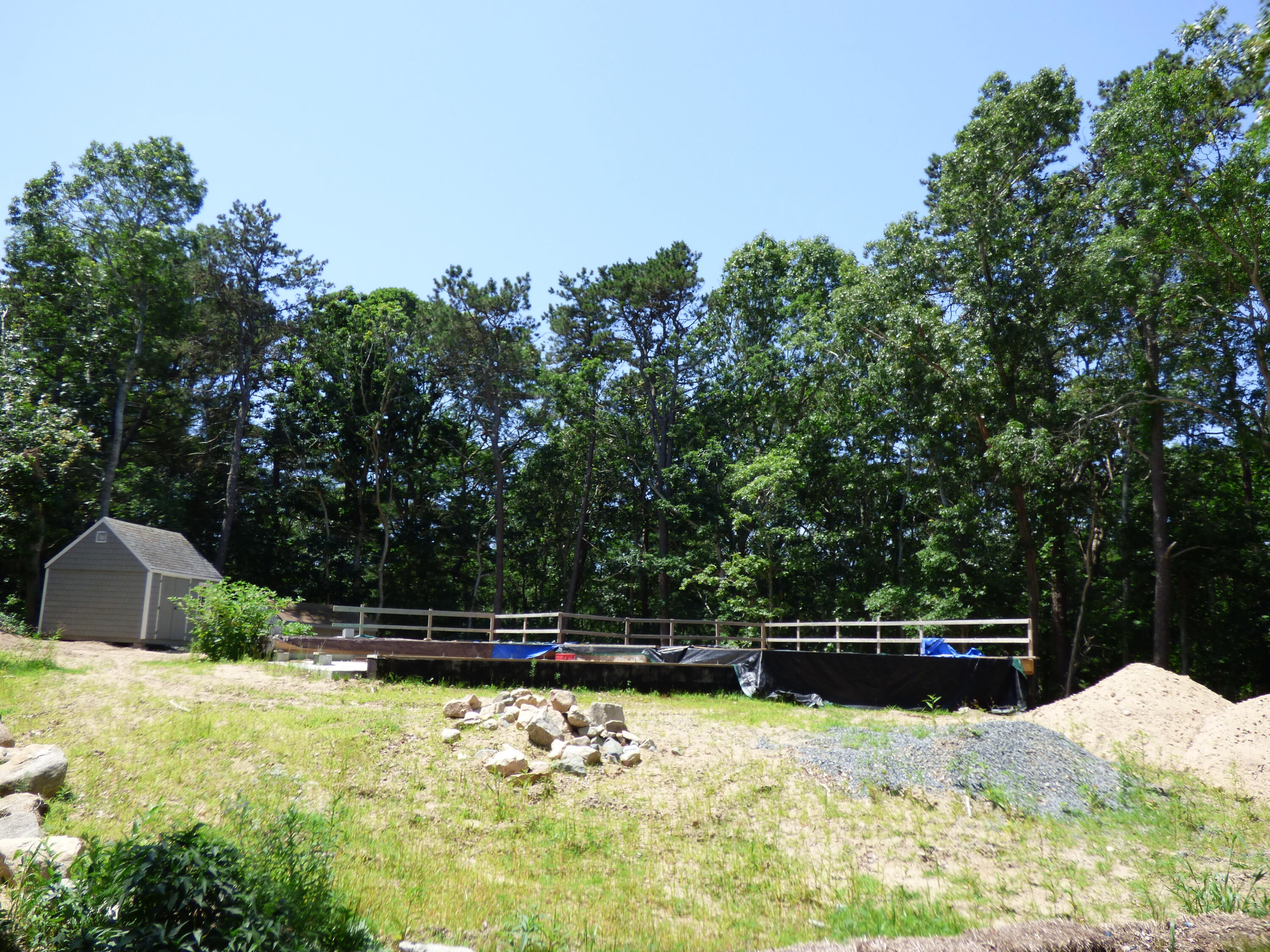 38 Weaver Road Centerville, MA 02632 - Photo 3 of 18 a backyard of a house with lots of green space