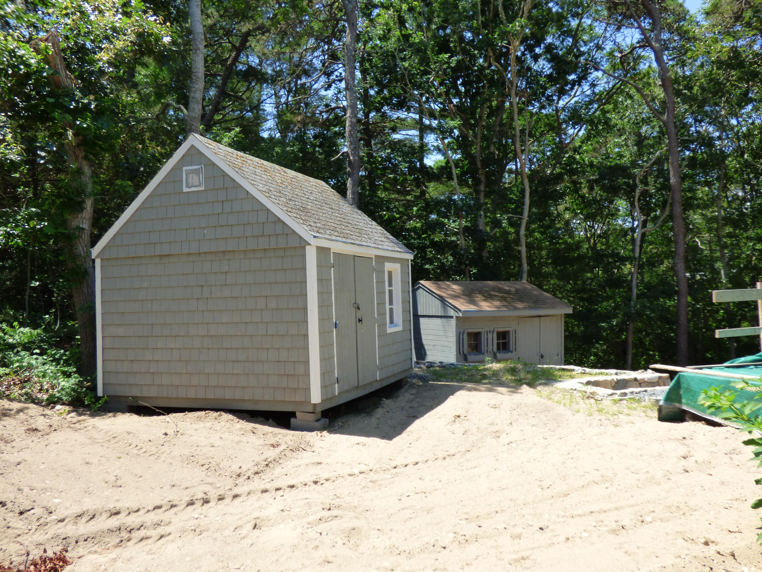 38 Weaver Road Centerville, MA 02632 - Photo 4 of 18 a view of a white house covered in snow