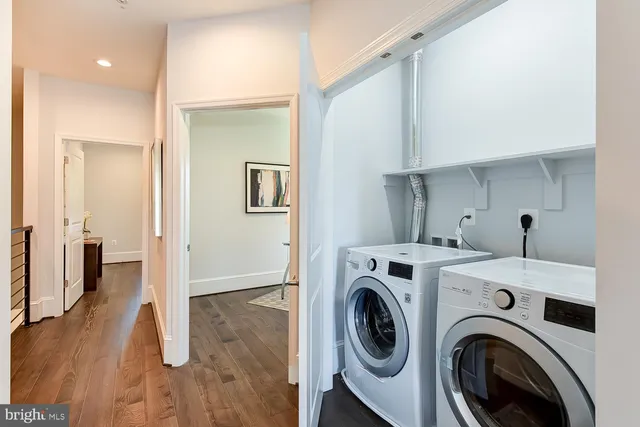 a view of storage and utility room with washer and dryer