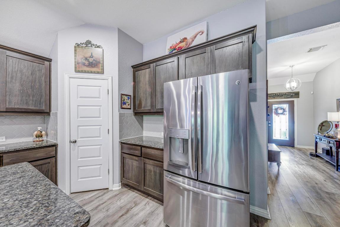 3101 Diego Cove Round Rock, TX 78665 - Photo 13 of 40 a kitchen with a refrigerator and a sink