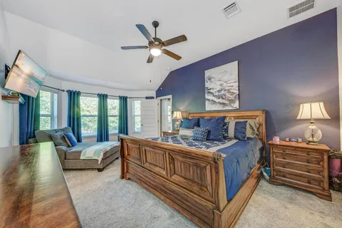 a living room with furniture and a rug