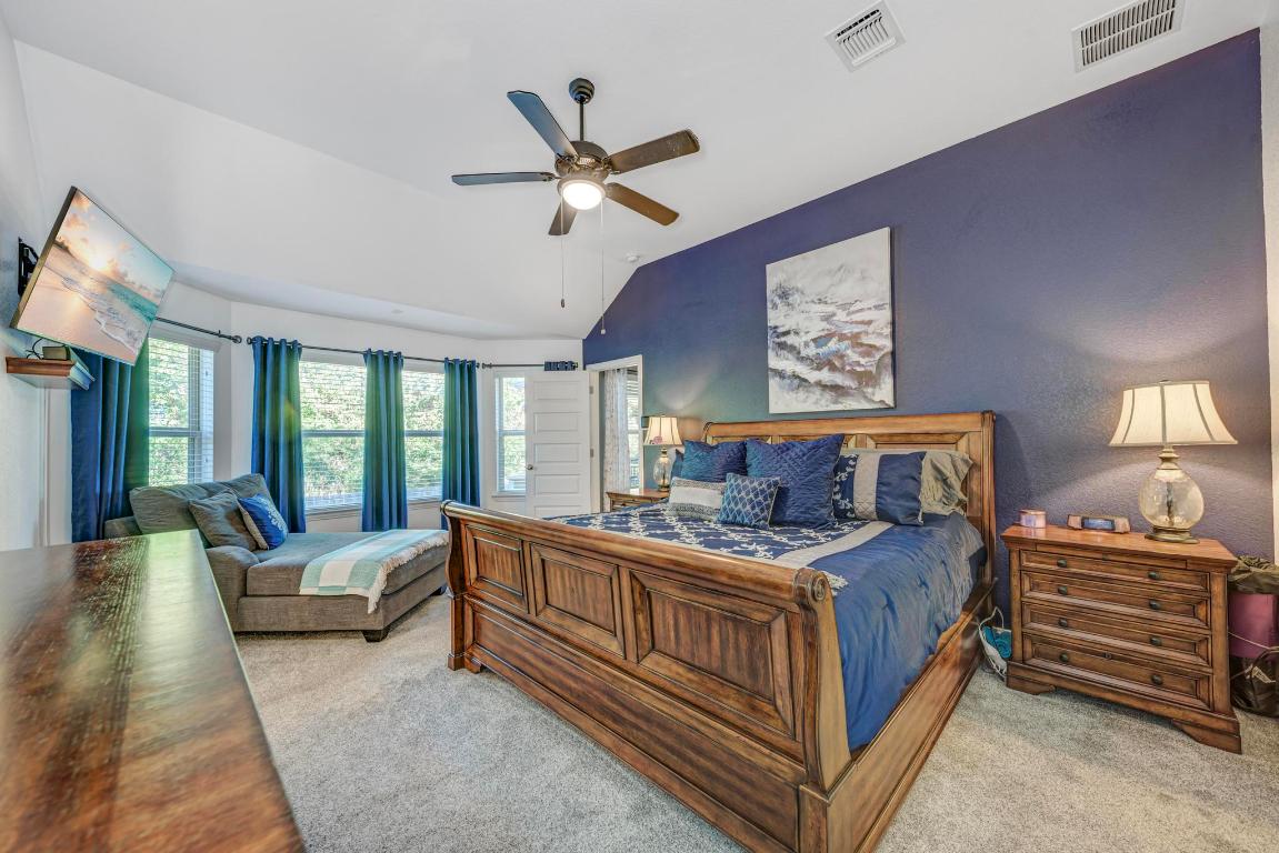 3101 Diego Cove Round Rock, TX 78665 - Photo 18 of 40 a bedroom with a bed and a chandelier