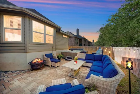 a backyard of a house with seating space