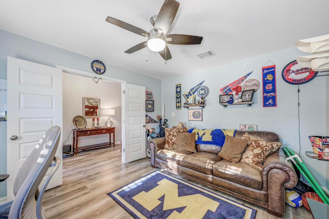 3101 Diego Cove Round Rock, TX 78665 - Photo 21 of 40 a living room with furniture and a wooden floor