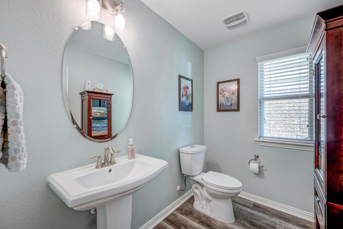 3101 Diego Cove Round Rock, TX 78665 - Photo 27 of 40 a bathroom with a toilet sink and mirror