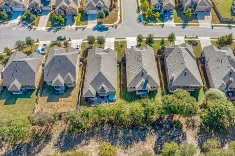 a balcony with couch and a potted plant