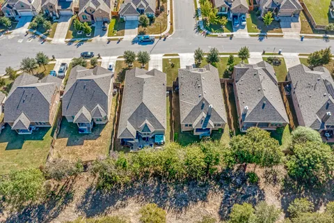 a view of a two chairs in the balcony