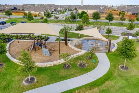 an aerial view of a house with outdoor space