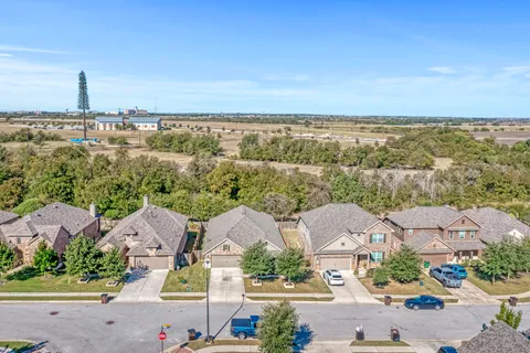 an aerial view of a house with a garden