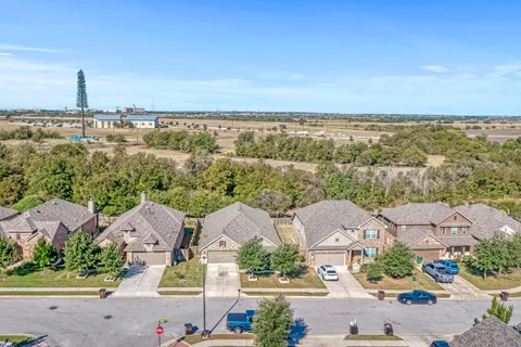 an aerial view of a house with a garden