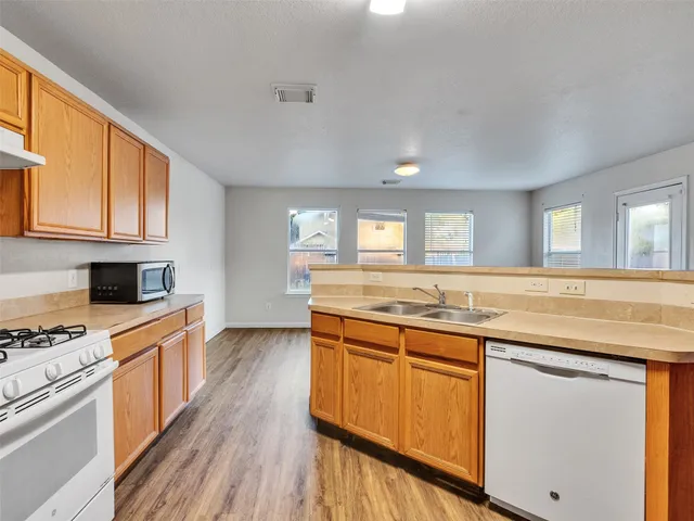 a view of a hallway with a door