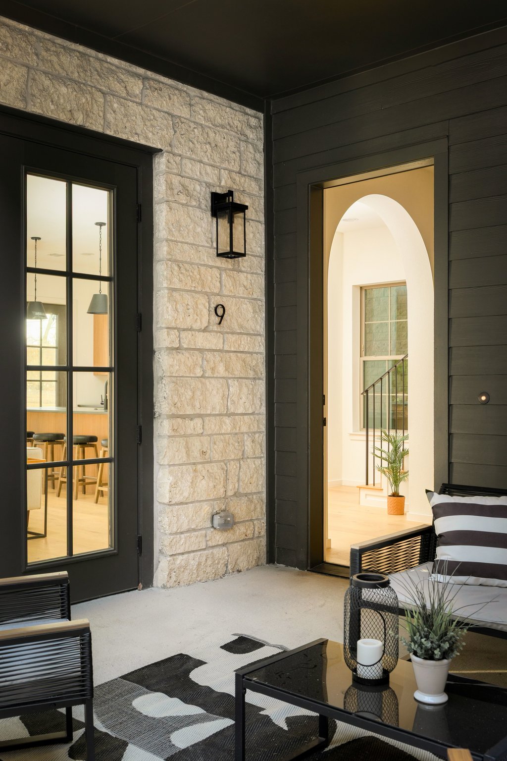 3500 Pecan Springs Road, Unit 13 Austin, TX 78723 - Photo 29 of 33 Stunning entry with courtyard and arched doorway just in sight.