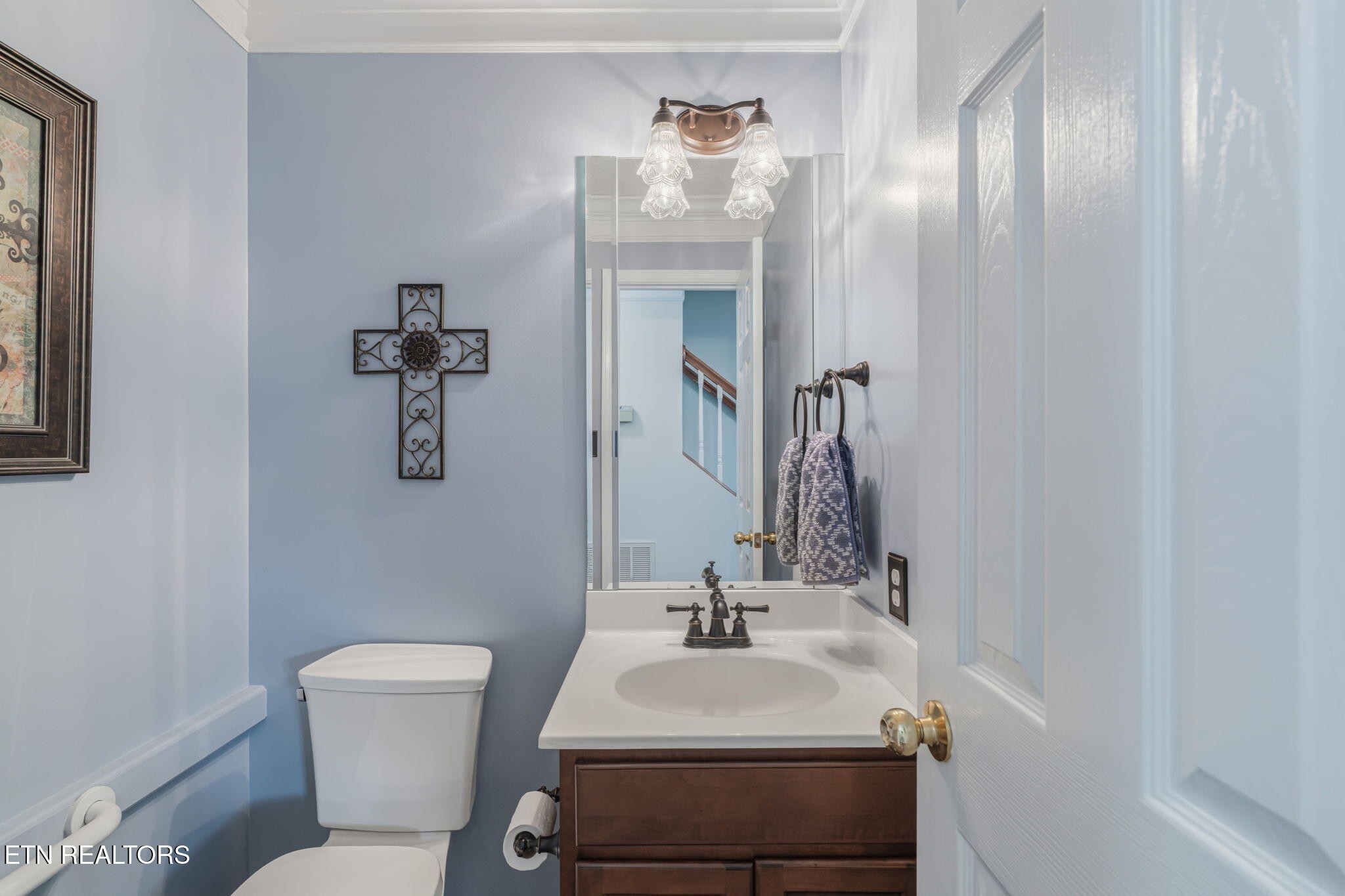 7030 Westerly Winds Road Knoxville, TN 37931 - Photo 21 of 40 a bathroom with a sink toilet and mirror
