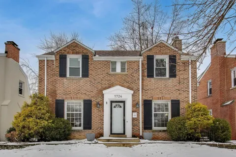a front view of a house with yard