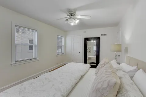 a bedroom with a large bed and closet