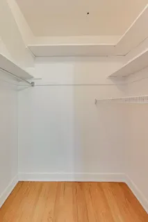 a bed room with a bed and a chandelier