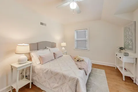 a bedroom with a bed and a table