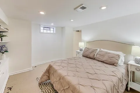 a large white bed in a white room