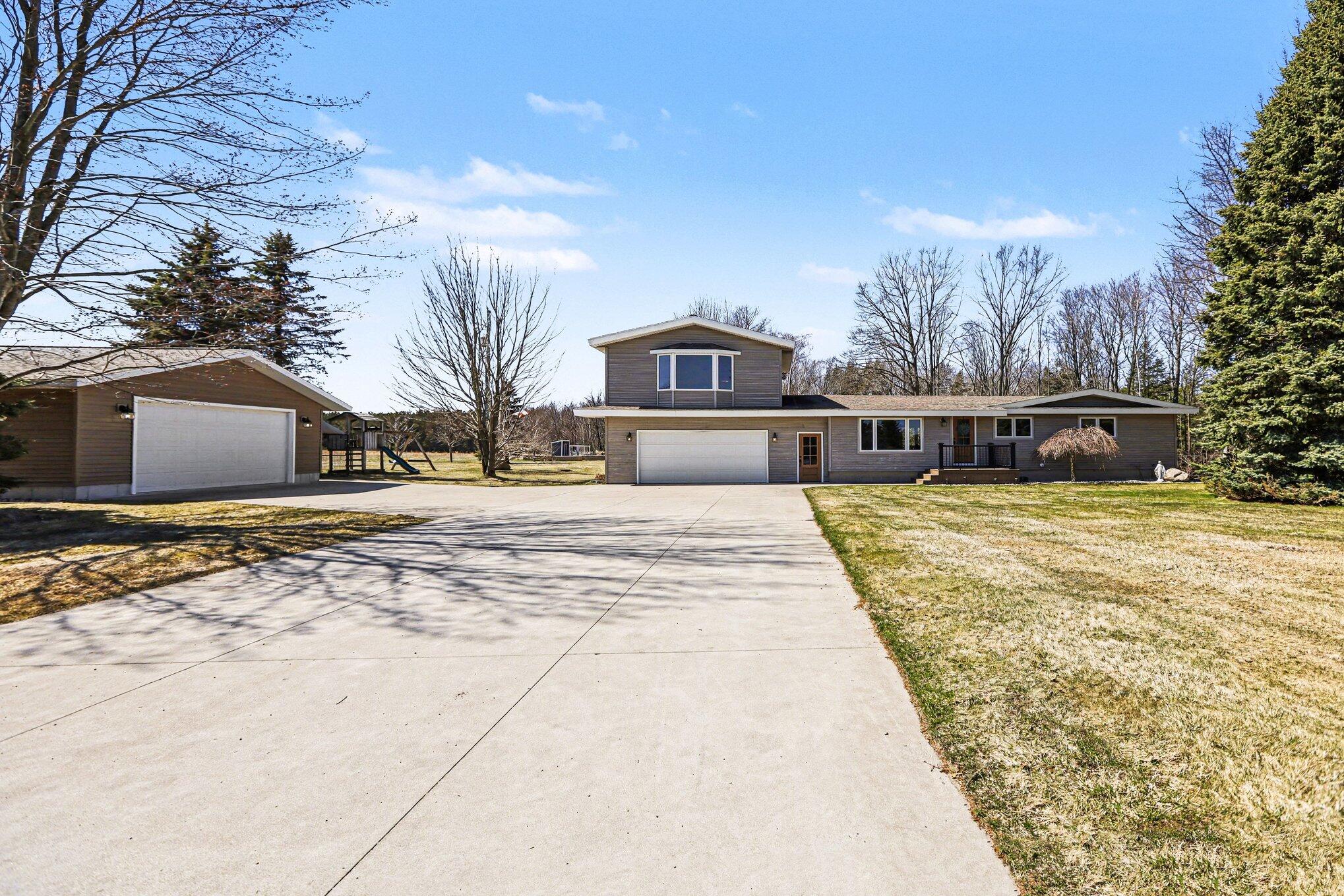 4786 Red Apple Road Manistee, MI 49660 - Photo 2 of 47 Front of house