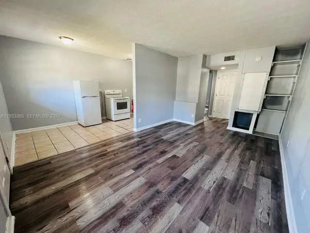 a view of a livingroom with wooden floor