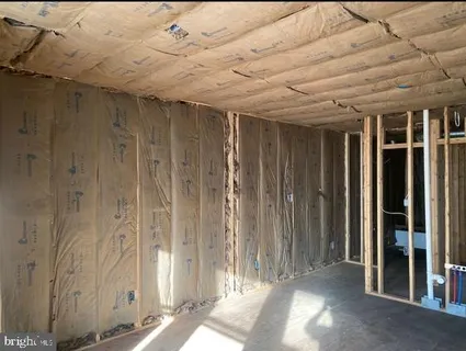 a view of a room with wooden walls