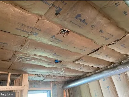 a view of front door with wooden floor