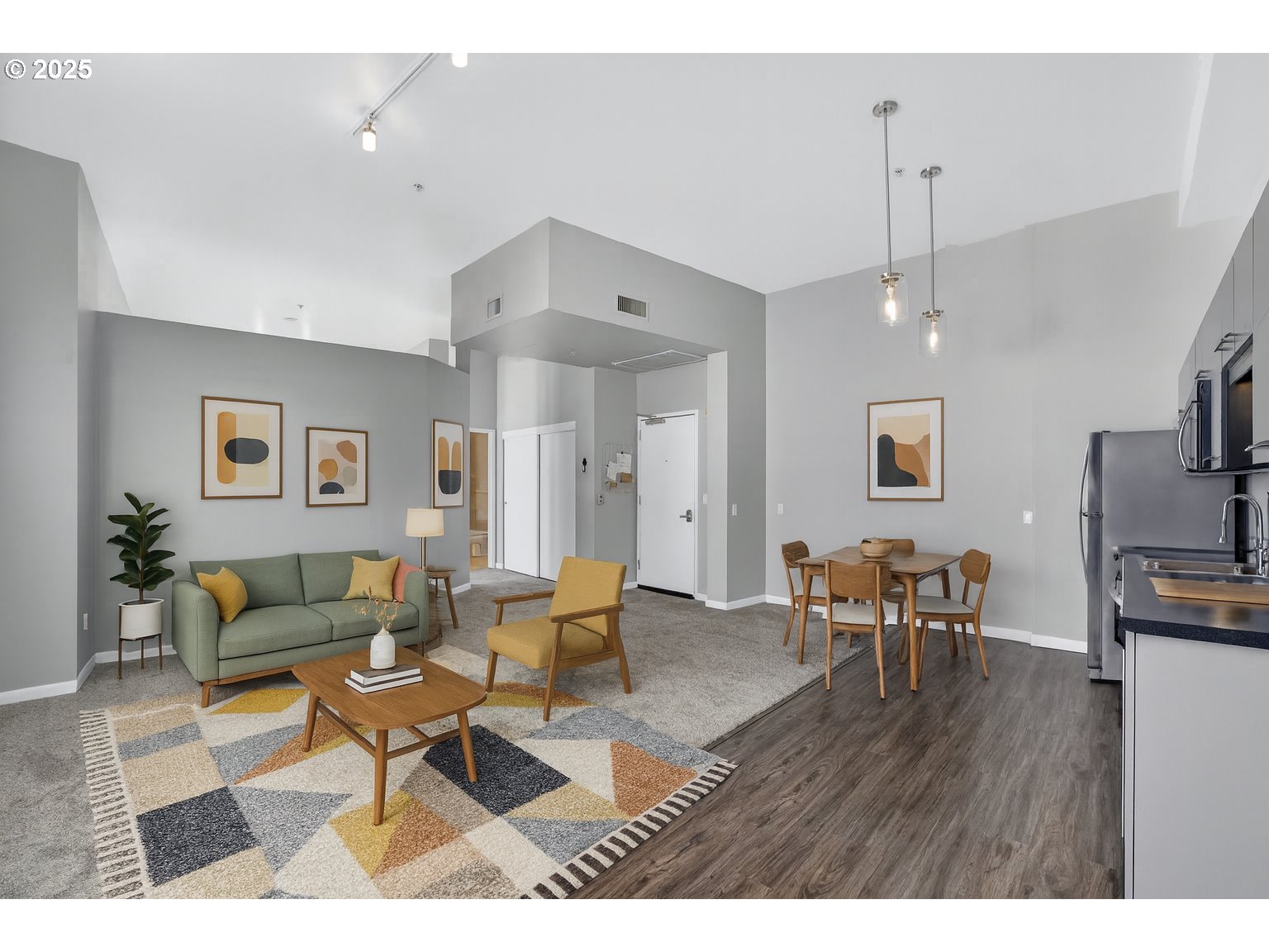 12600 Southwest Crescent Street, Unit 420 Beaverton, OR 97005 - Photo 16 of 45 a living room with furniture a dining table and a wooden floor