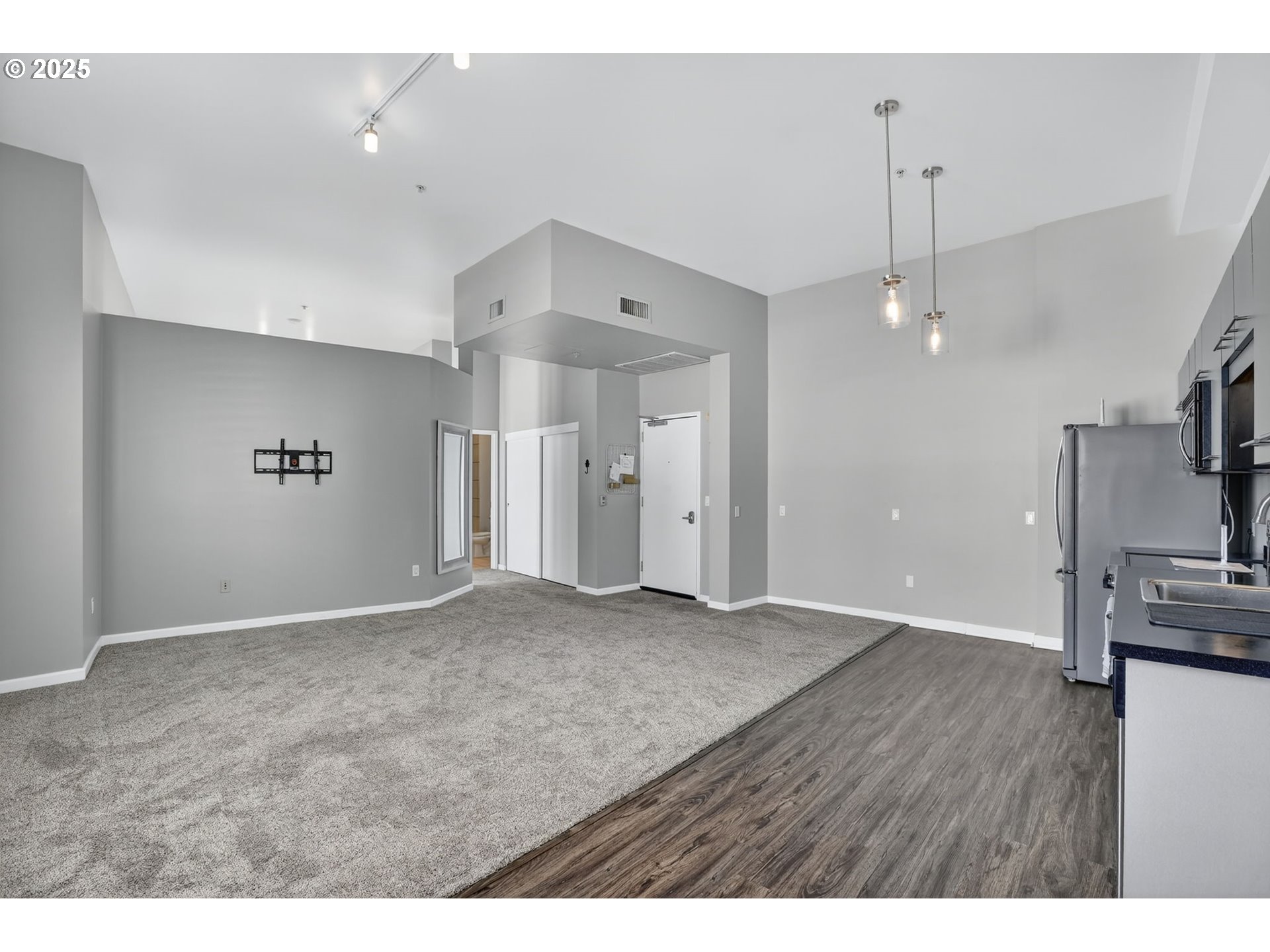 12600 Southwest Crescent Street, Unit 420 Beaverton, OR 97005 - Photo 17 of 45 a view of a kitchen with a sink and a refrigerator
