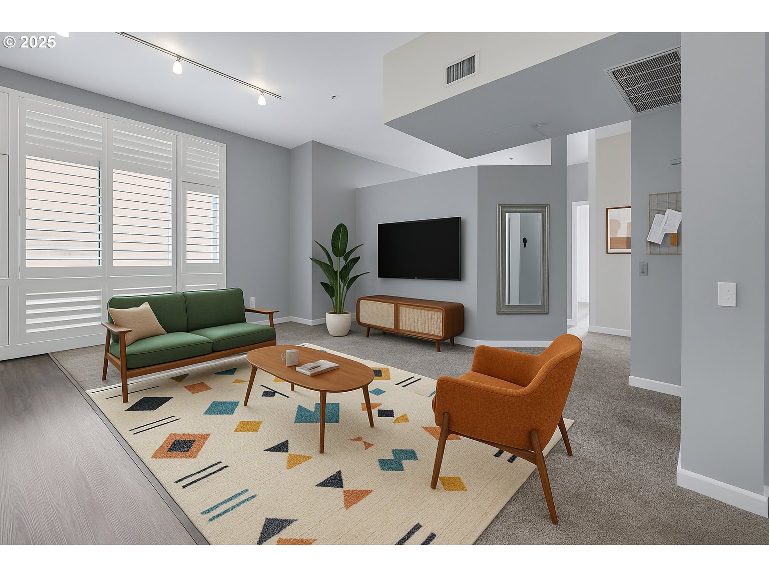 12600 Southwest Crescent Street, Unit 420 Beaverton, OR 97005 - Photo 18 of 45 a living room with furniture and a flat screen tv