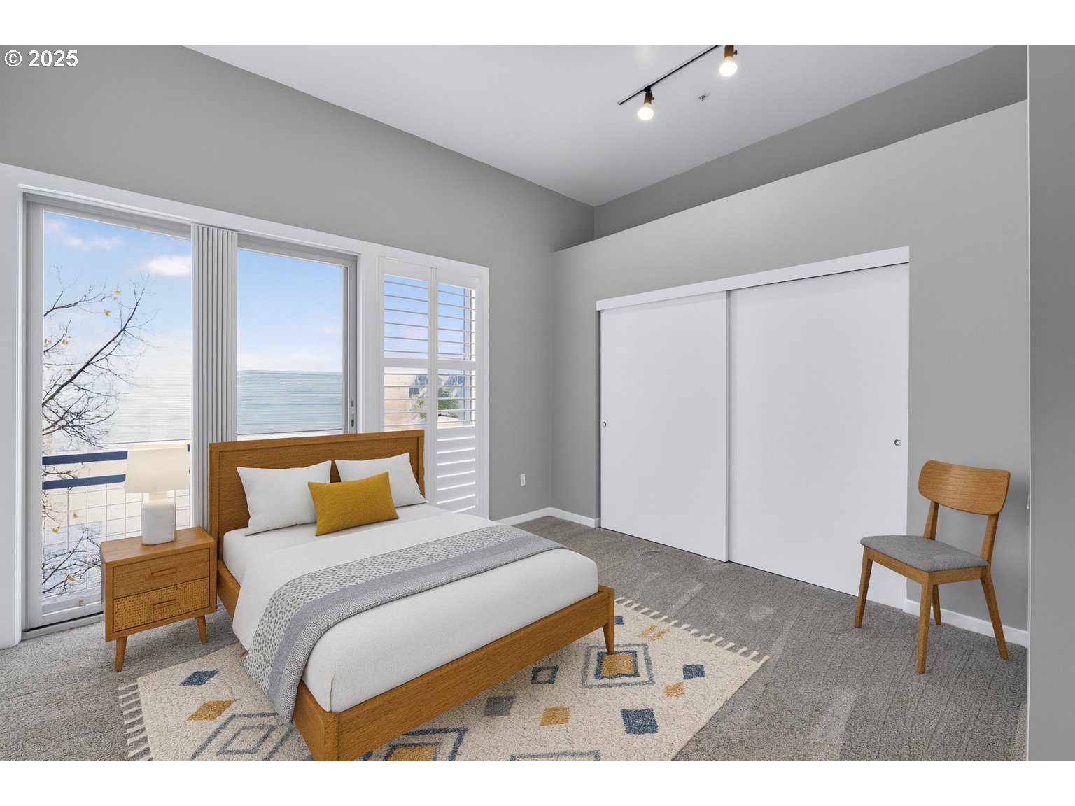 12600 Southwest Crescent Street, Unit 420 Beaverton, OR 97005 - Photo 20 of 45 a bedroom with a bed and a chair in it