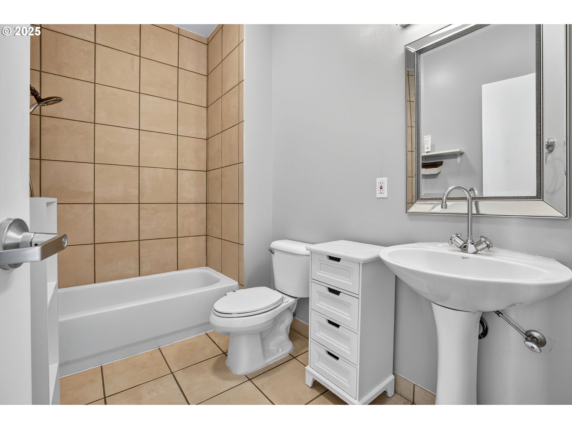 12600 Southwest Crescent Street, Unit 420 Beaverton, OR 97005 - Photo 30 of 45 a bathroom with a sink a toilet a mirror and shower