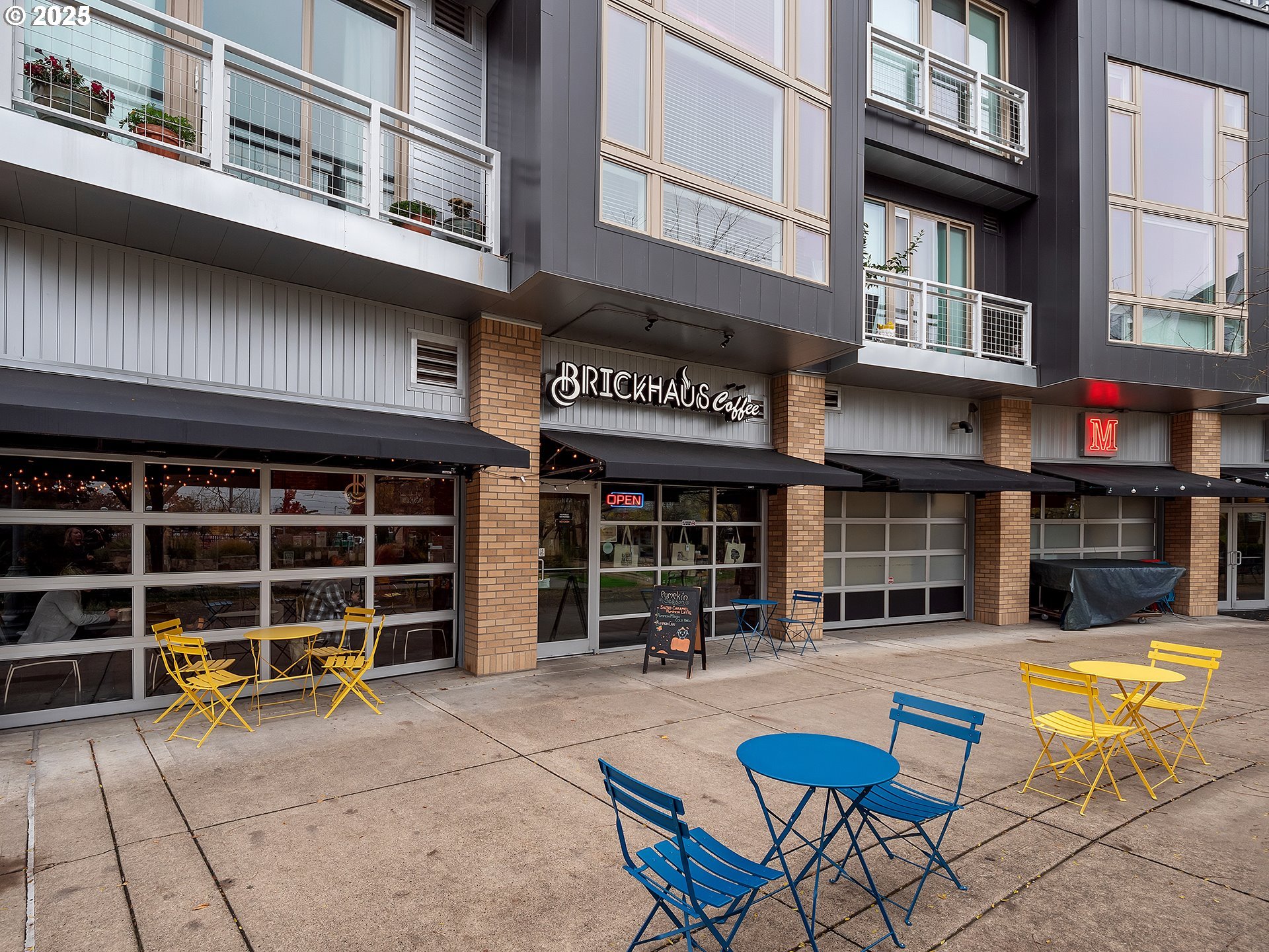 12600 Southwest Crescent Street, Unit 420 Beaverton, OR 97005 - Photo 36 of 45 a view of a building with a large window and a fireplace