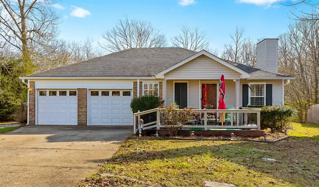 a view of house with outdoor space and porch