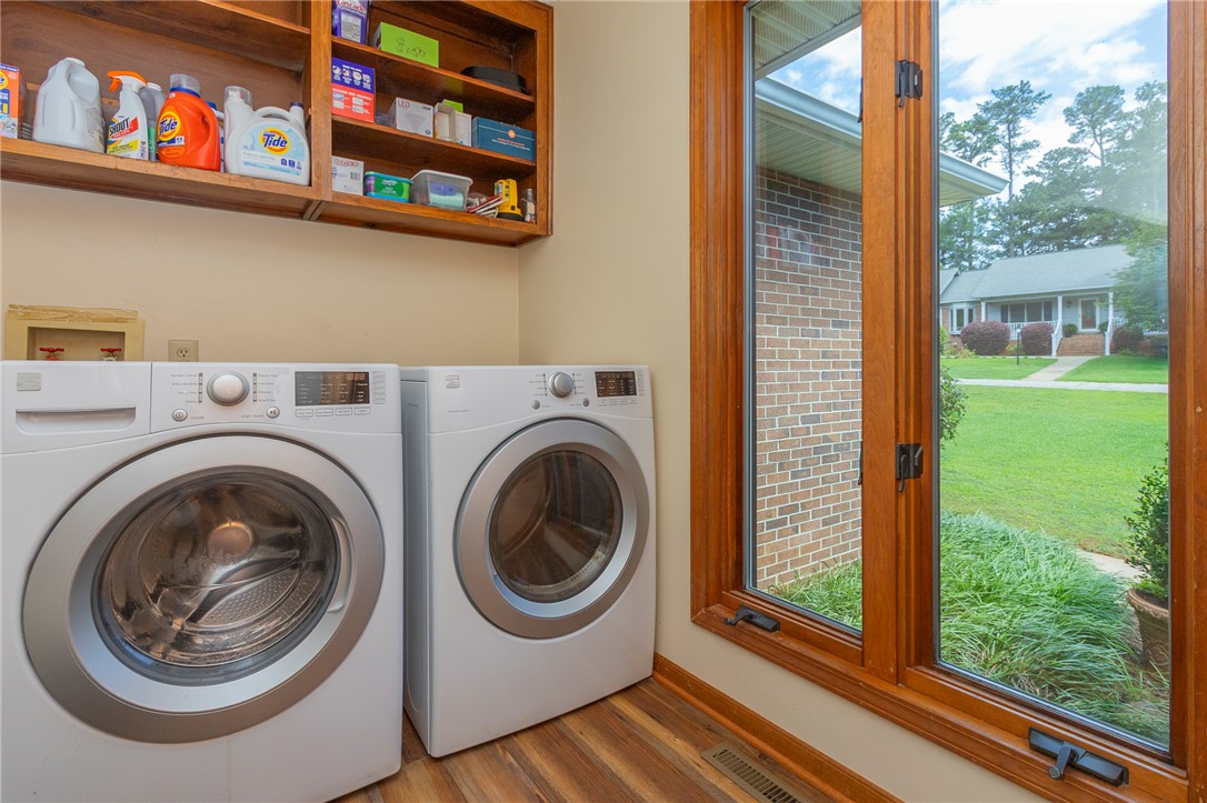 207 Laurel Ridge Road Anderson, SC 29621 - Photo 25 of 50 Functional laundry space with a window overlooking the verdant front yard and brick exterior.