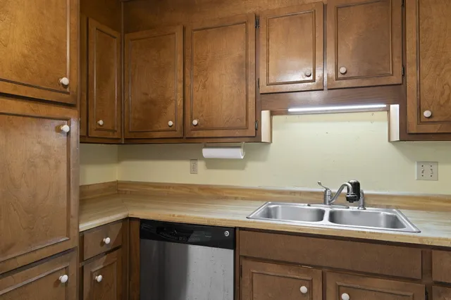 a kitchen with a sink and cabinets