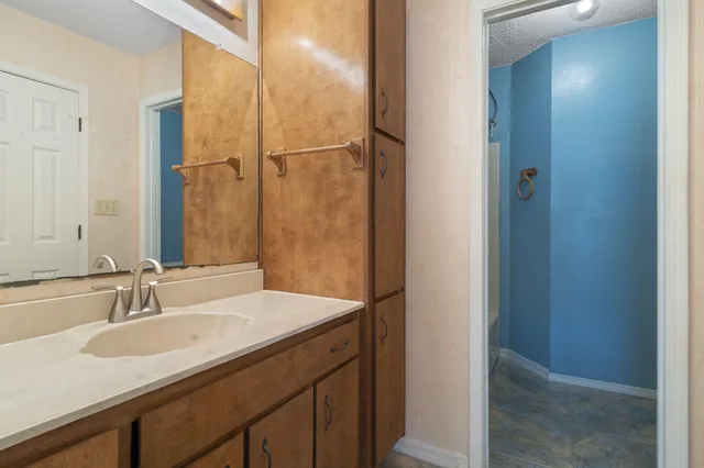 a bathroom with a sink and a mirror