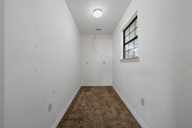 a view of entryway and wooden floor