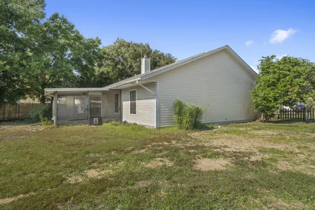 a house with trees in the background