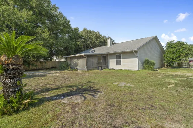 an aerial view of a house with a garden