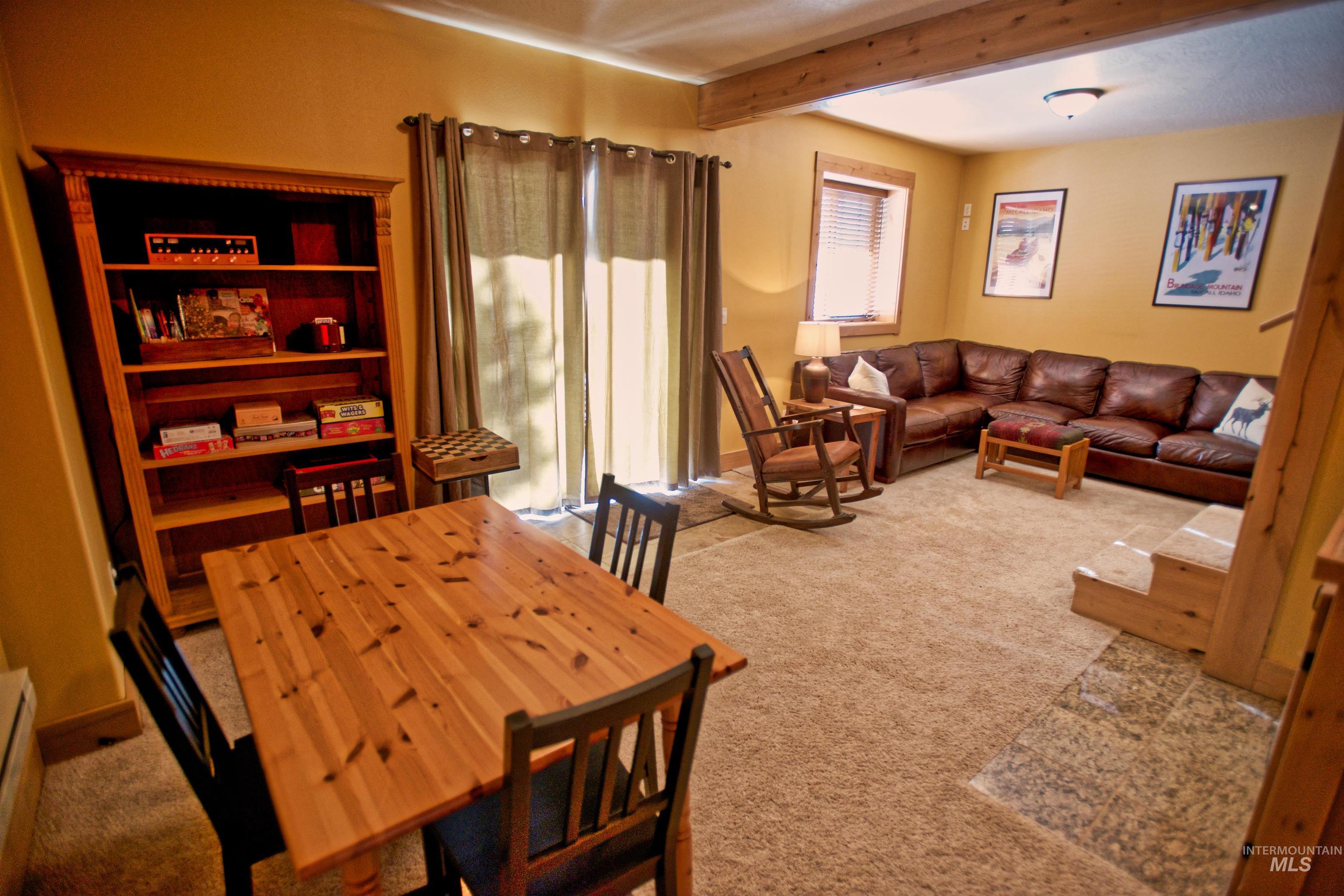 788 Chad Loop McCall, ID 83638 - Photo 19 of 22 Spacious room featuring exposed wood ceiling beams and carpeted flooring