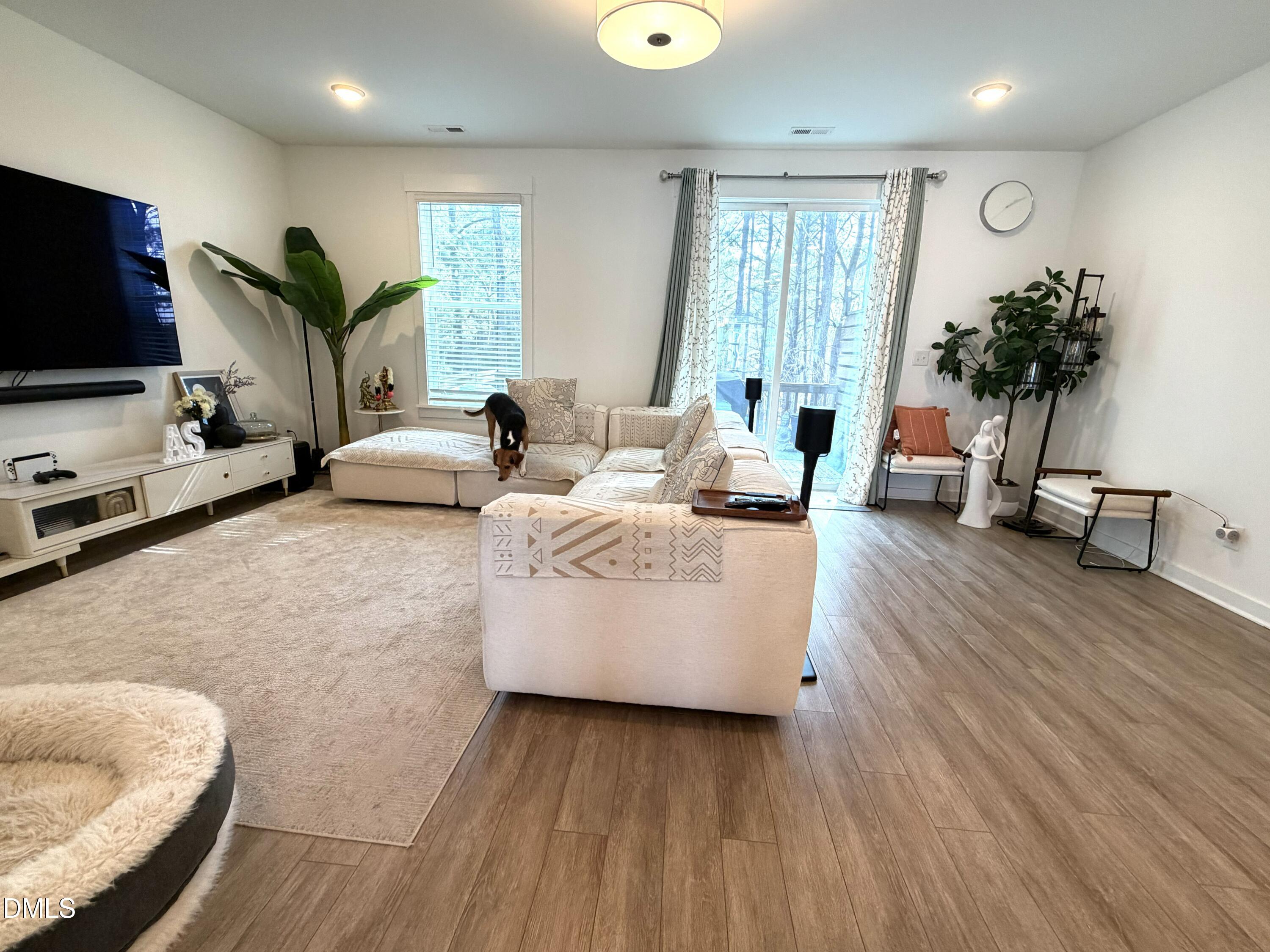 1250 Corkery Ridge Court Cary, NC 27519 - Photo 11 of 31 a living room with furniture and a flat screen tv